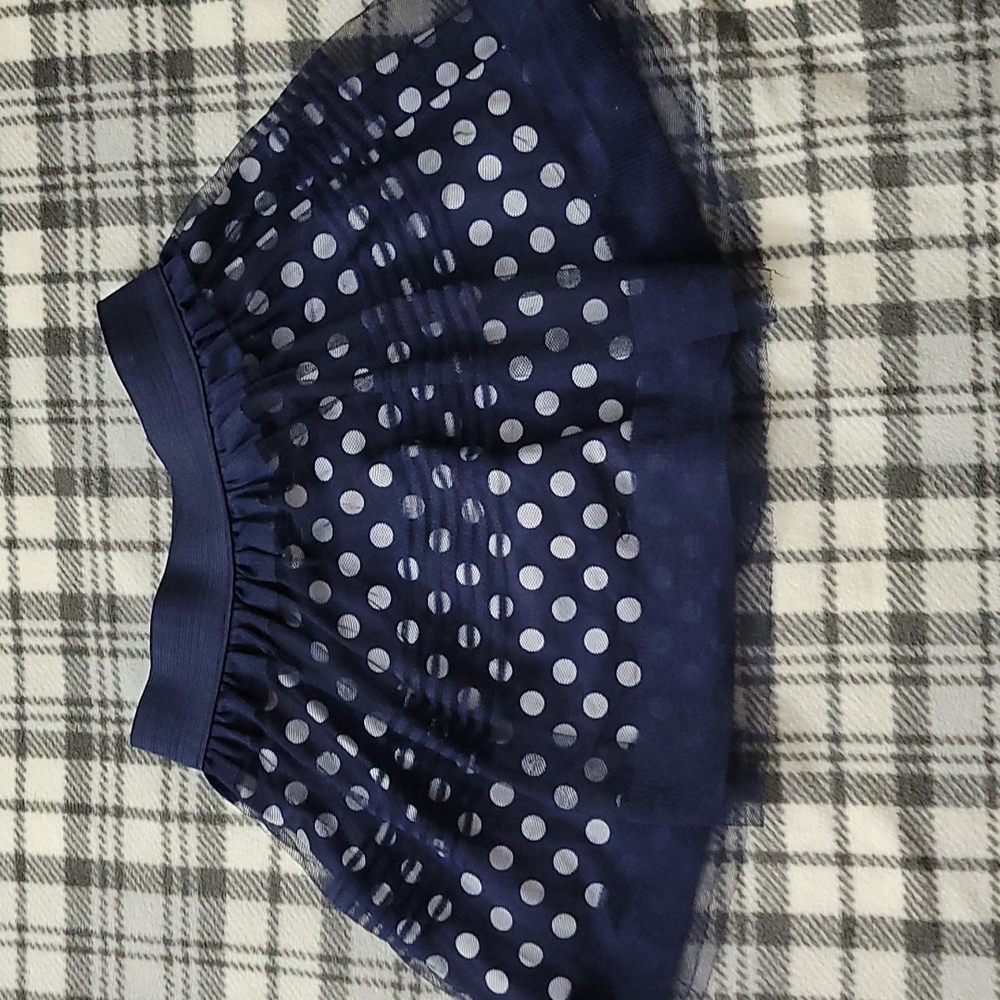 Polka dot skirt with tule overlay.